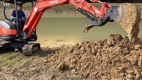 digging a pond with an excavator